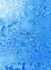 Fototapeta na wymiar Ice pattern on winter glass