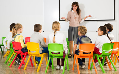 Teacher with children during lesson