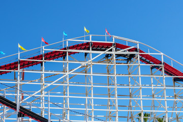 Old wood vintage roller coaster, amusement park.
