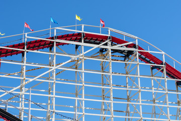 Old wood vintage roller coaster, amusement park.