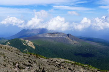 Shinmoe-dake and Takachiho-no-mine volcano ridge seen from Karakuni-dake, Ebino kogen, Japan