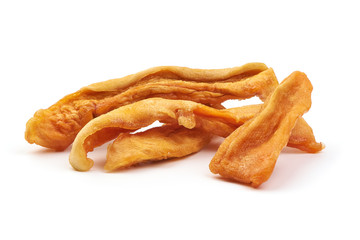 Dried Papaya Strips, sweet fruit slices, close-up, isolated on white background