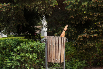 Spanish ham, pork leg with hoof thrown into a wooden urn in the Park of Madrid