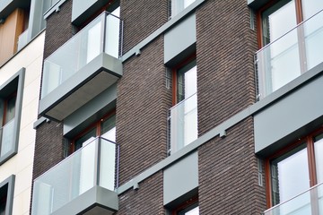 Fragment of a modern apartment building in front. Very modern apartment house.