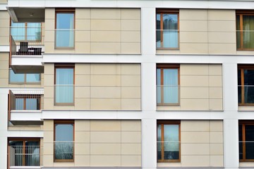 Fototapeta premium Fragment of a modern apartment building in front. Very modern apartment house.