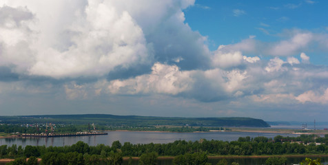 Panoramic view on the river and town with clouds