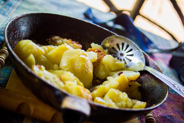 appetizing fried potatoes, on the summer terrace