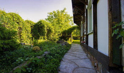 courtyard in the shade of a country house, Sunny summer day