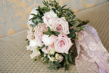 Elegant, refined and stylish wedding bouquet of roses in the hands of the bride. Bouquet of roses purple, cream, white and pink. Fresh flowers. Wedding bouquet in bride's hands, david austin.