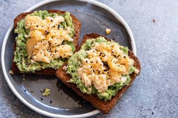 Toast with mashed avocado and scramble egg