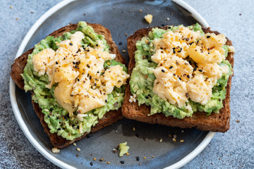 Toast with mashed avocado and scramble egg