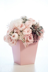 Bridal bouquet of pink and white peonies, in a square package.