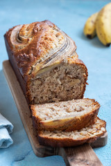 Sliced banana bread loaf with a walnuts