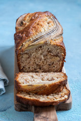 Sliced banana bread loaf with a walnuts