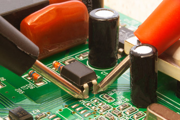 Electronic circuit board close up with different lighting.