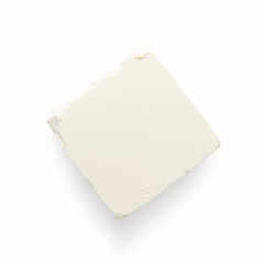 Greek feta cube on white