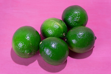 Set of limes on colorful background