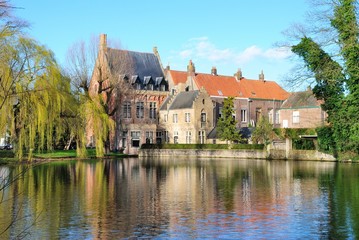 Fototapeta na wymiar View of the Groenerei canal and the medieval houses in Brugge (Bruges), Belgium