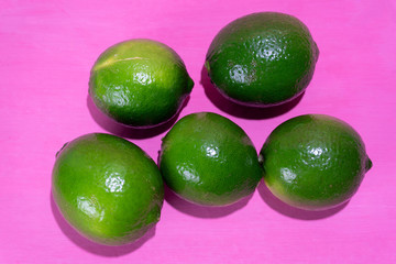 Set of limes on colorful background