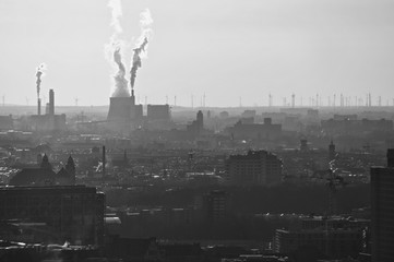 Environmental disaster: chimneys are letting out exhaust gases and carbon dioxide (Berlin 2018)