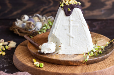Paskha (Pasha) with pistachios decorated with chocolate glaze and pistachios. Traditional Russian...