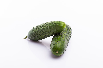 Fresh and ripe cucumbers isolated on white background