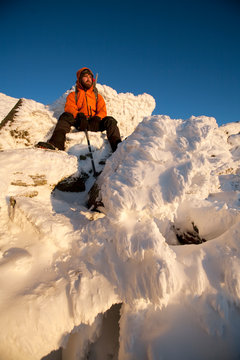 Ryan Buckley, Summit Intern hikes the northwest area of Mt. Washington's summit cone during some time off from his work.