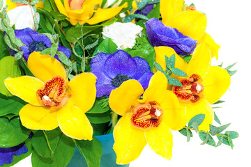 holiday bouquet of yellow orchids and blue anemones
