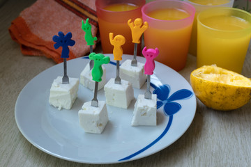 Cheese cubes and orange juice. Funny food.