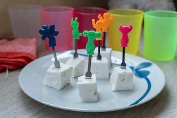 Cheese cubes with toothpicks.