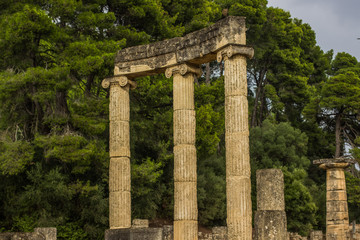 marble colonnade ancient architecture open air museum exhibit object in Peloponnese peninsula area in Greece in south Europe park outdoor natural environment sightseeing concept 