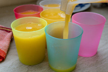 Orange Juice in colorful glasses.