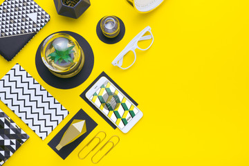 Man holds a tablet and looks at the screen. Mobile development. Innovational online businesses. Internet technologies. Trendy design. Geometry. Fashionable vibrant colors. Using a device. UX and UI.
