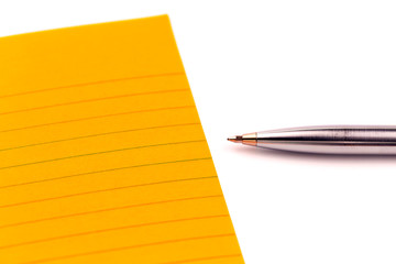 Concept Orange sheets of paper, pen and empty space for your text