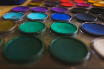 Pastel colors in a plastic round palette. 