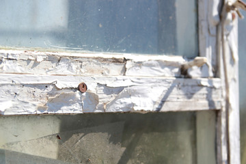 Tekstsura old window with glass and cracked paint