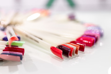 Obraz premium Nails samples palette in beauty salon. Nail design. Fashion concept. Beauty concept.