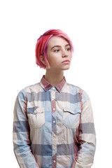 Young beautiful girl with a short hair cut pixie bob. Color hair coloring, red pink color. Shirt in a cellar, casual style.