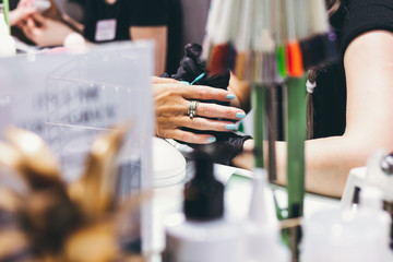 Master of manicure in work progress. Beauty salon. Hand treatment concept.