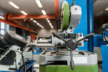Circular saw machine. Cutting a metal and steel with with sharp, circular blade in workshop...