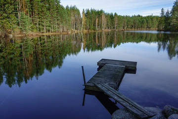 Jetty on perfectly calm lake