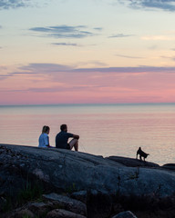 Couple and dog enjoying summer evening