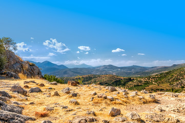 Fototapeta na wymiar Greece. View of ancient ruins of Mycenae at sunny summer day.