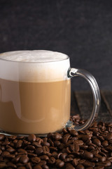 Cafe Latte Coffee in a Clear Glass Mug in a Dark Environment