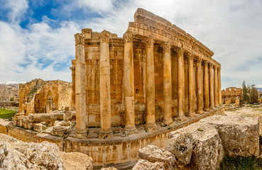 Naklejka premium Columns of ancient Roman temple of Bacchus with surrounding ruin