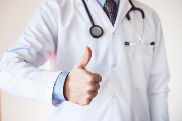 Doctor man showing an ok sign with fingers