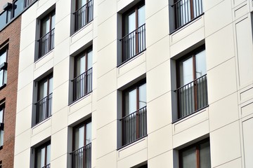Fragment of a modern apartment building in front. Very modern apartment house.