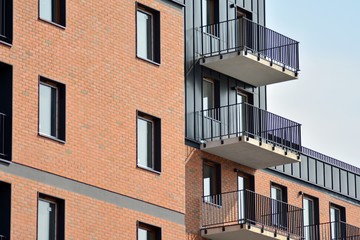 Fototapeta premium Fragment of a modern apartment building in front. Very modern apartment house.