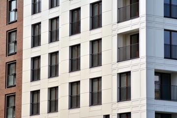 Fragment of a modern apartment building in front. Very modern apartment house.