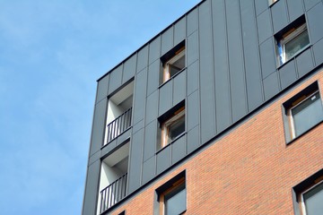 Fragment of a modern apartment building in front. Very modern apartment house.